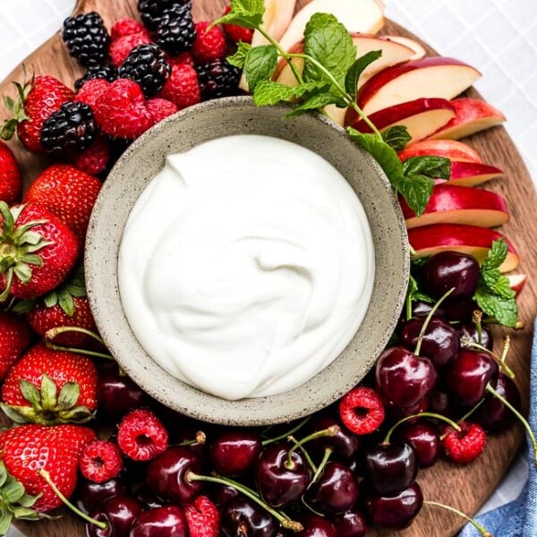 Yogurt Fruit Dip in a bowl served with various summer fruit.