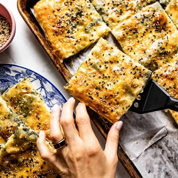 Turkish borek being served by a person