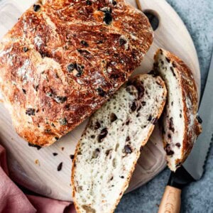 Sliced bread from the top view with a knife on the side.