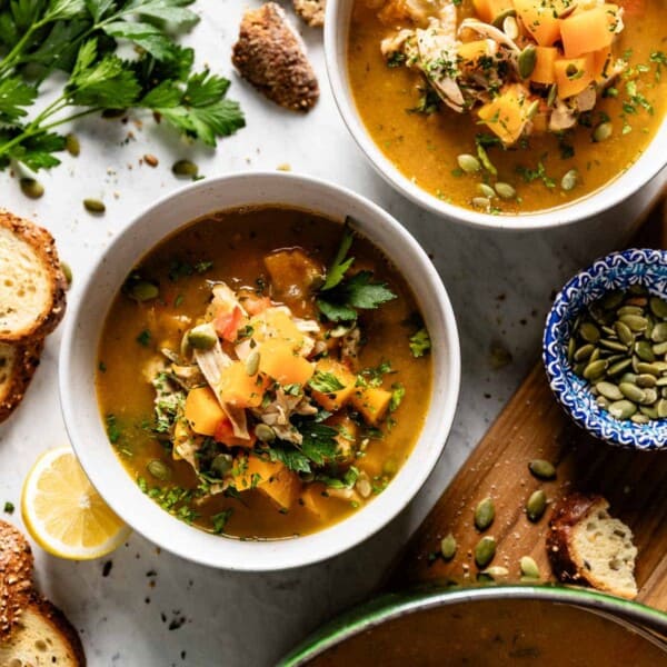 Chicken Butternut Squash Soup in bowls served with bread on the side.