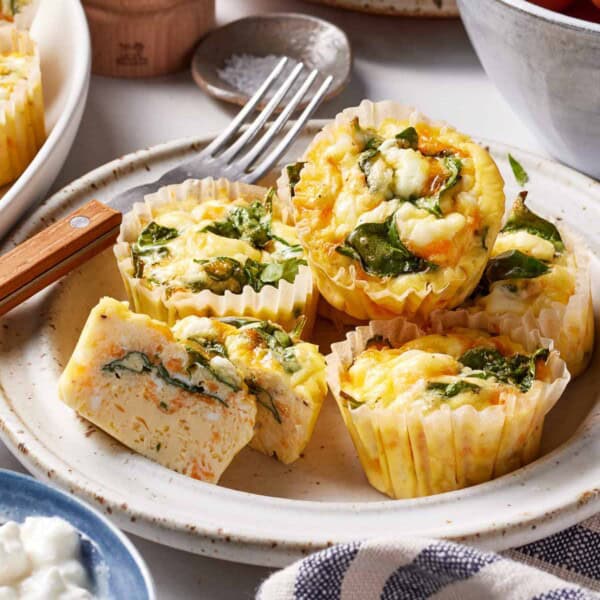 Cottage cheese egg bites on a plate with a fork on the side.