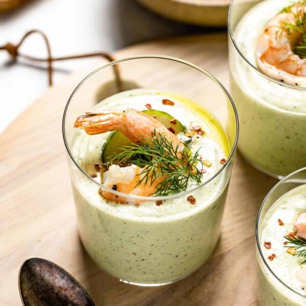 Barefoot Contessa Cucumber Soup in a glass with spoons on the side