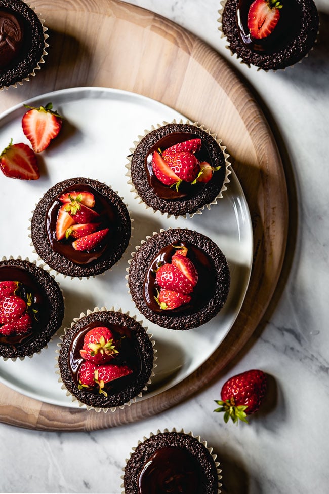 Chocolate muffins with strawberries on top