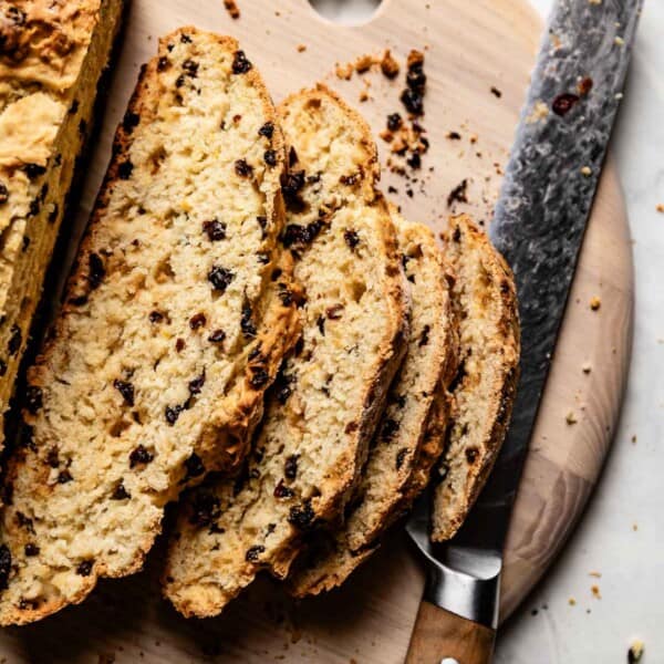 Irish soda bread sliced with a knife on the side.