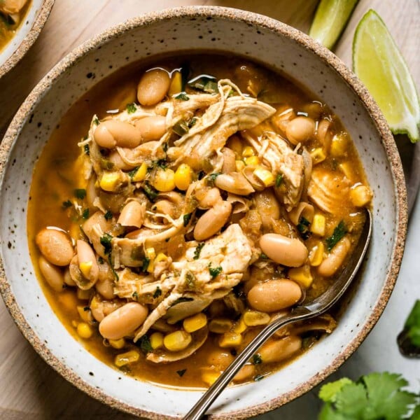 Instant Pot White bean chicken chili in a bowl with a spoon from top view