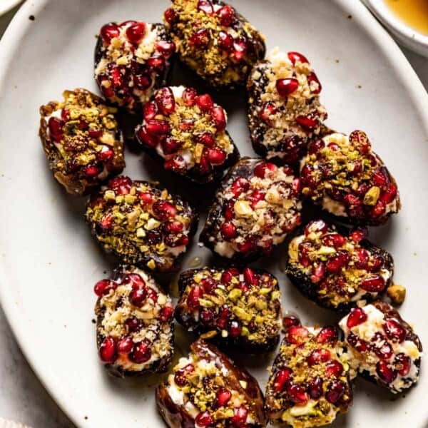 Mascarpone stuffed dates on a plate from the top view.