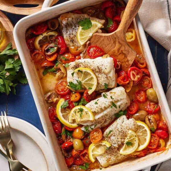 Mediterranean baked cod in a casserole dish from the top.