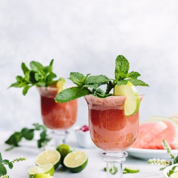 2 cups of Minty Watermelon Cucumber Smoothie garnished with mint