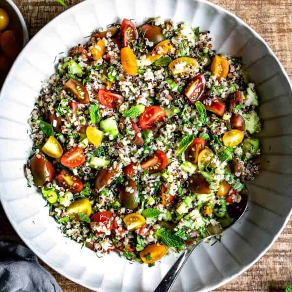 Quinoa Salad in a bowl with a spoon on the side