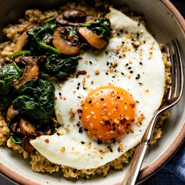 Savory steel cut oatmeal topped of with sauteed mushroom, spinach and a fried egg.