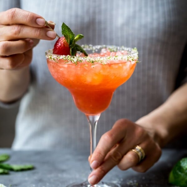 Strawberry Champagne Margaritas being served by a woman