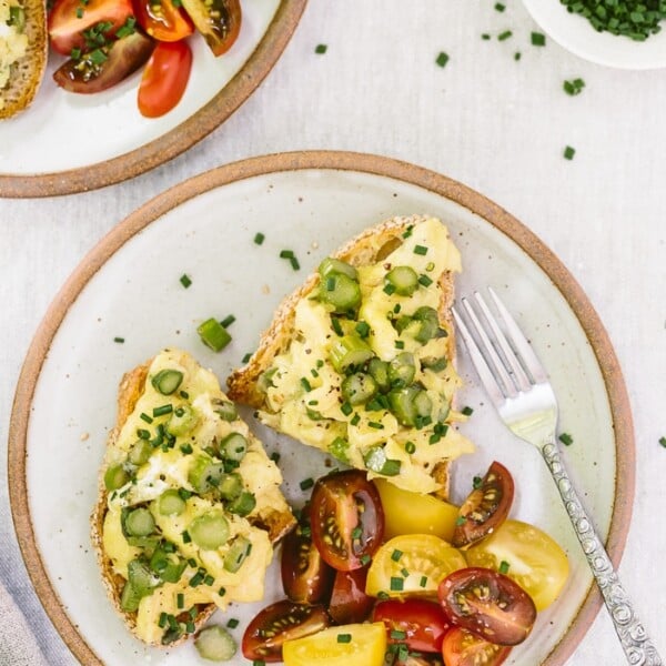 Truffled Asparagus Eggs on Toast Recipe: A quick and easy open-face sandwich recipe made with asparagus sautรฉed with truffle oil and mixed with eggs and goat cheese.