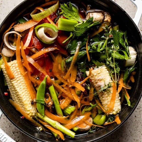 Veggie scraps are placed in a pot to make vegetable stock.